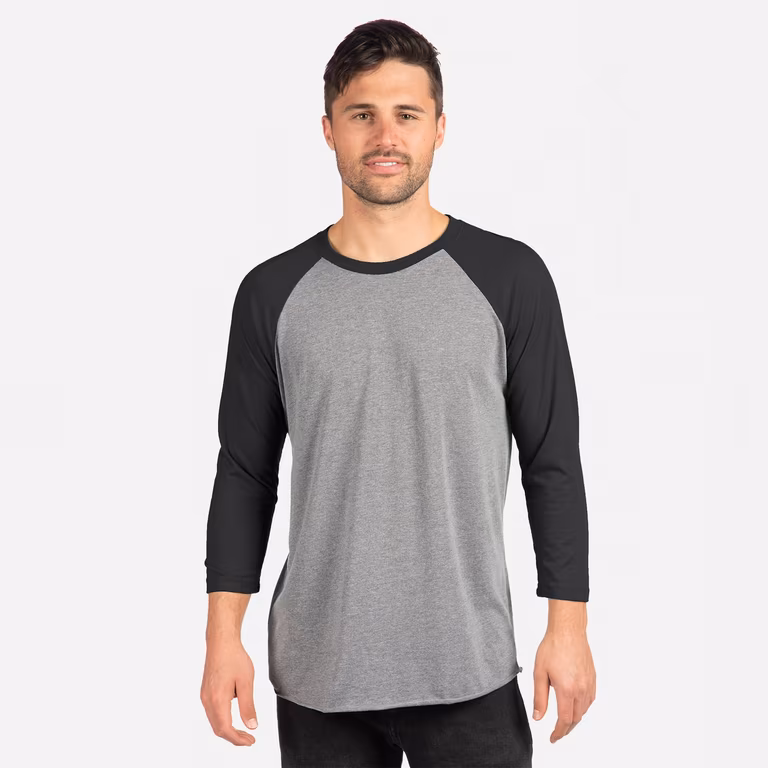 Unisex Triblend Three-Quarter Raglan T-Shirt — Vintage Black Sleeves/ Premium Heather Body, worn